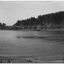 A coastline bay from same location as S10:5 (small dog) but view across to Snapes Point (with rocky coastline). Cliff House Hotel and Edinburgh House are visible on the left...