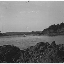 View of creek with sailing boat Original caption: Viea of creek with sailing boat