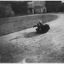 Dog rolling on ground Sedgeford Hall Original caption: Dog rolling on ground