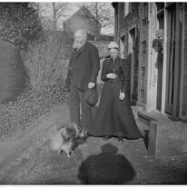 Rev Ogle and his wife at rear of vicarage Church Lane, Sedgeford Original caption: An old man and a lady