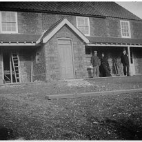Father and Rev Ogle and wife outside Brookdale Church Lane, Sedgeford Original caption: Father inspecting new house