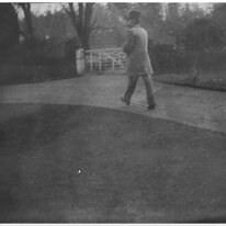 Gentleman walking up drive Original caption: Gentleman walking up drive