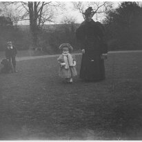 Lady with 2 small children Original caption: Lady with 2 small children