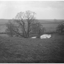 View south over The Ladywell opposite Hill Farm from west end of Church Lane Sedgeford Original caption: Landscape with river